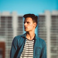 Man sporting trendy short haircut for stylish modern look.